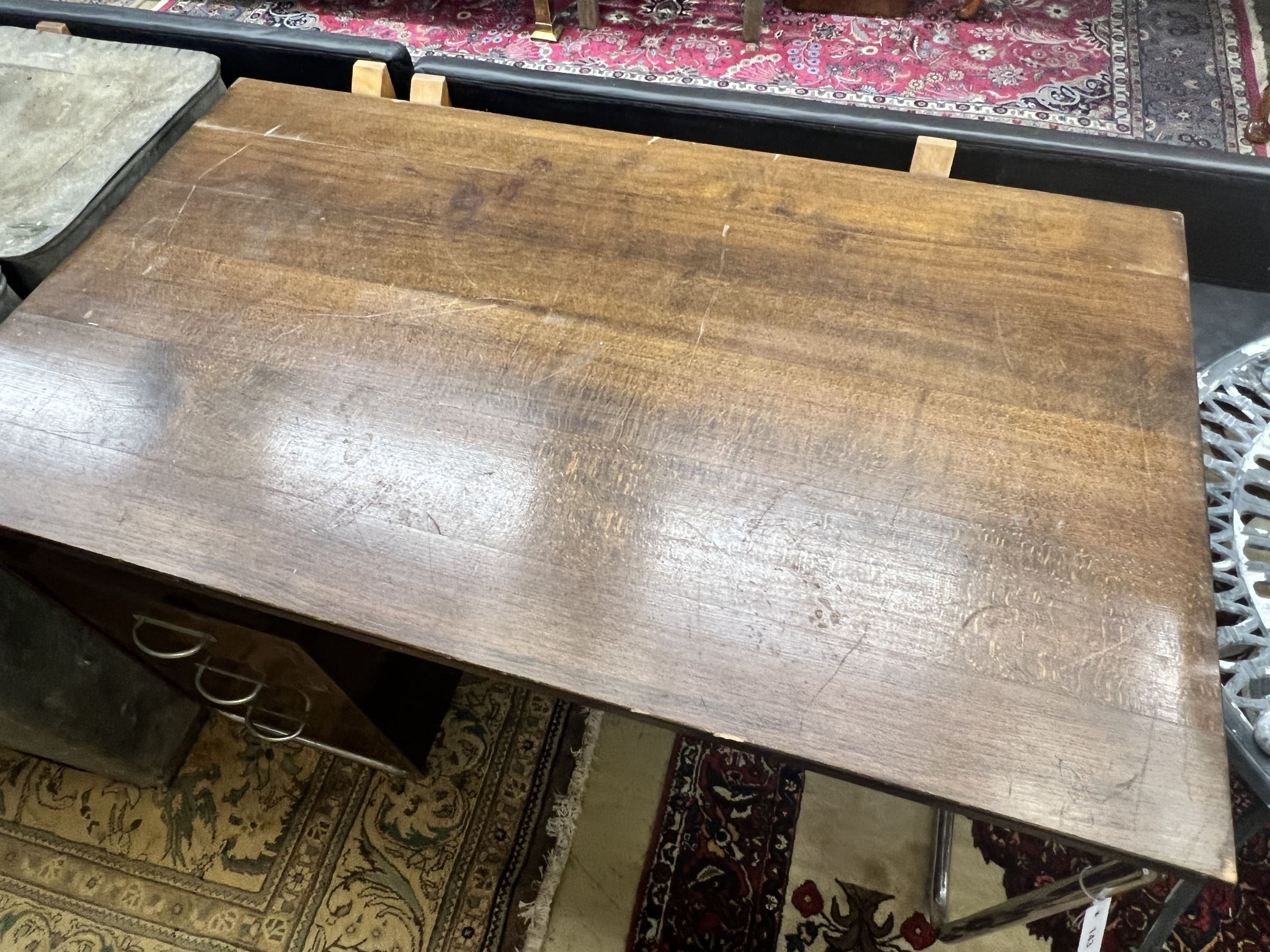 A modernist metal and beech kneehole desk, width 120cm depth 70cm height 75cm